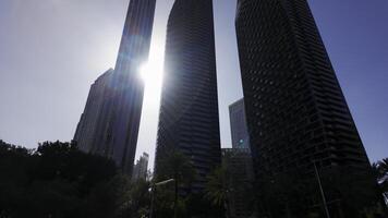 A low angle view of the skyscrapers in the centre of Dubai. Action. Concept of modern architecture. photo