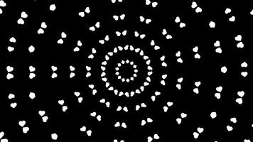 Rotating kaleidoscope of white small hearts on a black background. Animation. Radial rings of hearts, monochrome. photo