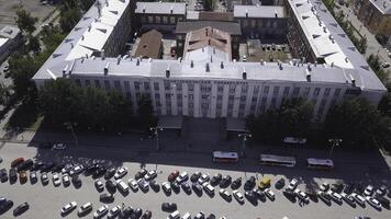 Aerial view of the avenue with developed infrastructure. Clip. Big city center with buildings, roads, trees, and many cars. photo