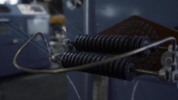 Coil winder machine with copper wire. Creative. Copper round rollers for rolling wire at the factory. photo