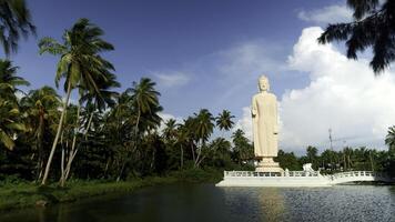 Peraliya Buddha Statue, the Tsunami Memorial in Hikkaduwa, Sri Lanka. Action. Touristic attraction, famous landmark. photo