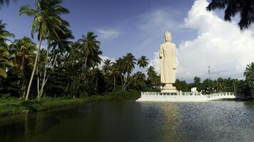 Peraliya Buddha Statue, the Tsunami Memorial in Hikkaduwa, Sri Lanka. Action. Touristic attraction, famous landmark. photo