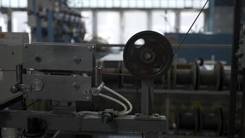 Cable production process, mechanism in a cable factory. Creative. Industrial background with spinning coils. photo