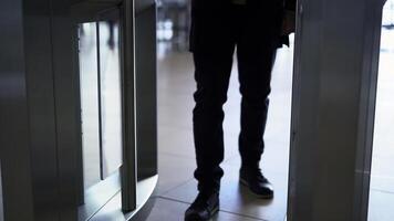 Man passing through the security gates. Media. Man using turnstile to enter the shopping center or subway. photo