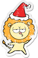 distressed sticker cartoon of a bored lion wearing santa hat png