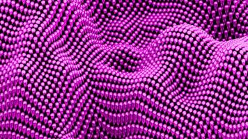 omhoog en naar beneden in beweging oppervlakte van kleurrijk klein ballen. ontwerp. klein kralen structuur in beweging. video