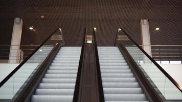 Empty moving staircase running up and down. Media. Modern indoor escalator stairs. video