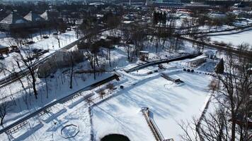 Top view of cottage town in suburbs in winter. Creative. Beautiful town with private houses in suburbs. Village near modern city on sunny winter day video