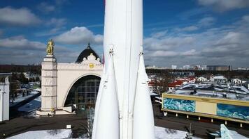 Rocket on city square in winter. Creative. Top view of monument to space flight in center of historical square of city. Beautiful view of rocket monument in honor of flight into space on winter day video