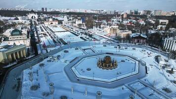 Historic square with fountain in winter. Creative. Top view of beautiful square with fountain on sunny winter day. Historical square of Soviet city with beautiful architecture in winter video
