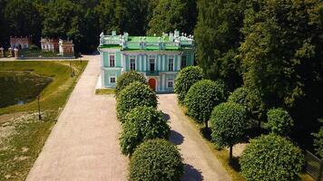 Top view of historic building with garden and pond. Creative. Beautiful park and garden with Baroque estate. Tourists walk in historical park with ancient building video