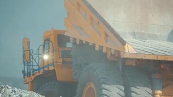 Close-up of the limestone ore unloading from mining truck. View from back. video