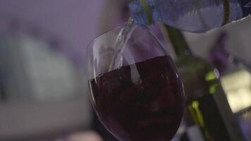 Red drink with ice and fruits. Frame. Close-up of water addition video