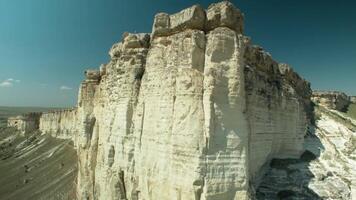 Aerial view of the rock with fields and sky. Shot. Beautiful canyon aerial view video