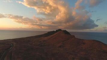 Beautiful rock at sunset aerial view. Shot. Large rock near the sea video