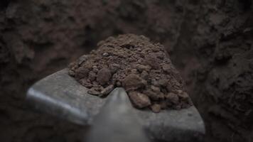 To dig in the Shovel. Footage. Soil with shovel view of a shovel. Close-up, shallow DOF. Digging spring soil with shovel video