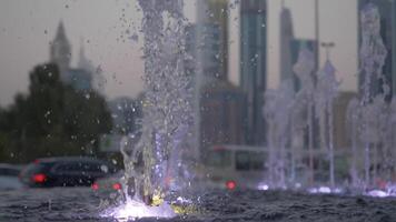 Water of dry fountain in the park close-up. Water shooting out of a fountain. Streams of fountain close-up. Slow motion video