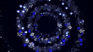 Abstract rotating spiral of snowflakes and blue Christmas tree toys on black background, seamless loop. Animation. Winter holidays, New Year wreath glowing spiral. video