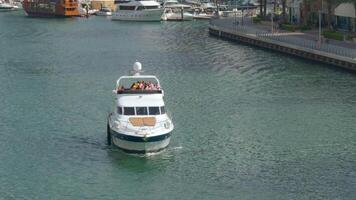 Dudai, UAE - May 9,2023. view of a yachts with tourists and the canal. Action. People on board having fun during vacation. video