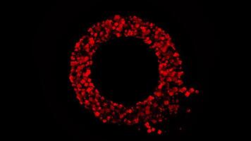 Circle of many colored red particles that flying into the sides on black background. Animation. Abstract ring formed by tiny pyramids and cubes. video