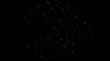 Confetti flying towards the camera slowly on black background. Animation. Abstract many falling tiny confetti pieces of different colors. video