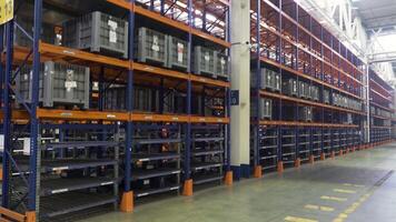 Large and spacious warehouse with many plastic boxes on the shelves. Scene. Logistic, storage, shipment, industry and manufacturing concept. video