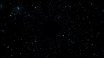 Many rows of blurred dots forming a space tunnel on black background, seamless loop. Animation. Giant cloud of dots moving and spinning in the dark. video
