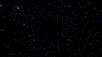 Many rows of blurred dots forming a space tunnel on black background, seamless loop. Animation. Giant cloud of dots moving and spinning in the dark. video