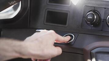 Close up of man hand pushing the car starting button. Scene. View inside of a luxury expensive vehicle, driver starting the engine by pressing the button. video