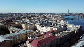 Birdseye view of Neva river and central areas of Saint Petersburg, Russia. Stock footage. Aerial view of summer city with beautiful houses and blue water surface, architecture concept. video