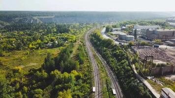 Top view of city's industrial district in summer. Stock footage. Industrial plants, businesses and warehouses located in suburbs in summer video