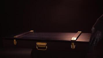 Close up of ancient valuable sward lying inside of wooden case with gold clasps. Stock footage. Hands in leather gloves open beautiful case with the antique exhibit, steel sabre inside. video