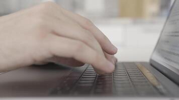 Working at home with laptop, male hands on the keyboard. Action. Close up side view of hands typing on keypad of the computer, concept of modern technologies. video