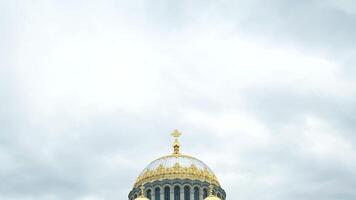 Naval cathedral of Saint Nicholas in Kronstadt, St.-Petersburg, Russia. Concept. Breathtaking white church with gold domes on cloudy sky background, religion and architecture theme. video