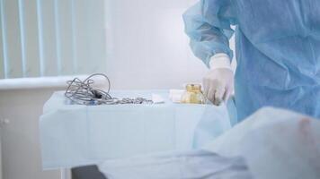 Close-up of surgeon taking scissors for surgery. Action. Surgical instruments required for operation. Surgeon uses scissors as intended for surgery video