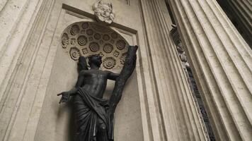 Bottom view of a statue in the niche of the Kazan Cathedral, Saint-Petersburg. Action. Concept of art and architecture, beautiful sculpture in the historic building. video