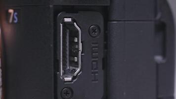 Close up of professional shooting camera details. Action. HDMI connector of the camera, concept of technologies. video