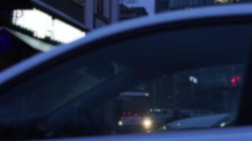 Close up of car window in the evening city street. Stock footage. Details of city street through transparent window of a passenger car. video