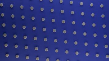 Abstract rotating dark blue background with white round dots, seamless loop. Animation. Spinning pattern with white circles contrasting to blue backdrop. video