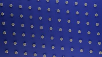 Abstract rotating dark blue background with white round dots, seamless loop. Animation. Spinning pattern with white circles contrasting to blue backdrop. video