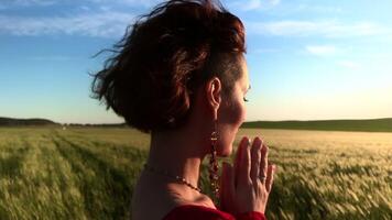 Believing woman with her eyes closed asking for forgiveness and peace. Stock clip. Feeling unity with nature. video