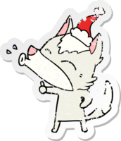 howling wolf hand drawn distressed sticker cartoon of a wearing santa hat png