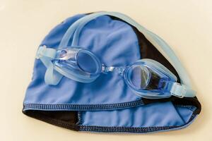 Sleek swimming gear combo with cap and goggles photo