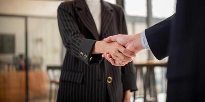 Handshake of two business people after contract agreement to become a partner, collaboration teamwork photo