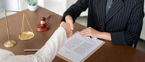 Businesswoman handshake to seal a deal judge female lawyers Consultation legal services Consulting in regard to the various contract to plan the case in court photo