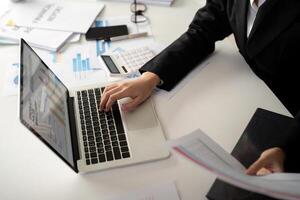 Documents, Business woman and accountant reading report for information, financial data or analysis. Paperwork, auditor check, review and bookkeeping, Calculate finance and tax in office photo