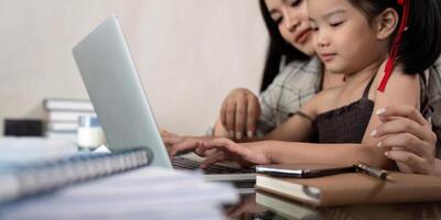 Working mom work from home office. businesswoman and cute child using laptop work freelancer workplace in home, Lifestyle family momen photo