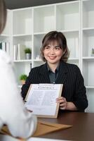 Company hired the lawyer office as a legal advisor and draft the contract so that the client could signs the right contract. Contract of sale was on the table in the lawyer office photo