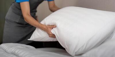 Woman staff cleaning service for work. young female cleaner a bedroom photo