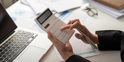 Documents, Business woman and accountant reading report for information, financial data or analysis. Paperwork, auditor check, review and bookkeeping, Calculate finance and tax in office photo